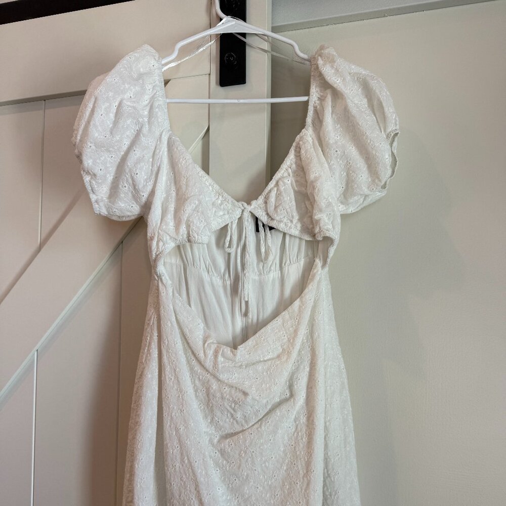 Kittenish white cut out mini dress
